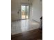 Bright dining area with tiled flooring and sliding door access to the yard at 14425 E Albrook Dr, Denver, CO 80239