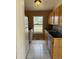 Classic kitchen with tile flooring and stainless steel sink at 14425 E Albrook Dr, Denver, CO 80239