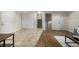 Spacious basement with tile and wood flooring leading to the stairwell at 7238 W Cedar Cir, Lakewood, CO 80226