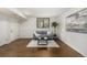 Cozy finished basement featuring a gray sofa, stylish coffee table and an area rug at 7238 W Cedar Cir, Lakewood, CO 80226