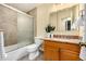 Bathroom featuring a shower/tub combo, granite counters, and a tiled floor at 7238 W Cedar Cir, Lakewood, CO 80226