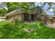 Charming two-story home with landscaped yard and inviting front porch at 7238 W Cedar Cir, Lakewood, CO 80226