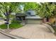 Charming two-story home with attached two car garage and manicured lawn at 7238 W Cedar Cir, Lakewood, CO 80226
