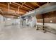 Large unfinished basement with exposed beams and utilities, ready for customization at 7238 W Cedar Cir, Lakewood, CO 80226