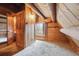 Charming bedroom featuring wood walls, wood beams, and natural light at 8409 S Otis St, Littleton, CO 80128