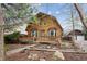 A-frame home with a cozy front porch, perfect for enjoying the outdoors at 8409 S Otis St, Littleton, CO 80128
