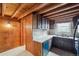 Kitchen with vintage wooden cabinets, a double sink, and linoleum flooring at 8409 S Otis St, Littleton, CO 80128
