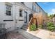 Backyard featuring a patio, wooden fence, and steps up to a metal security door at 723 31St St, Denver, CO 80205