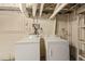 Basement featuring a side-by-side washer and dryer with exposed plumbing overhead at 723 31St St, Denver, CO 80205