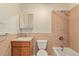 Bathroom featuring tile, tub, shower, toilet, and vanity with mirror at 723 31St St, Denver, CO 80205