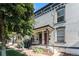 Charming white brick home with black trim and landscaped yard, located in a desirable neighborhood at 723 31St St, Denver, CO 80205