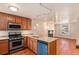 Cozy kitchen featuring wood cabinets, granite countertops, and stainless steel appliances at 723 31St St, Denver, CO 80205