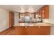 Modern kitchen featuring stainless steel appliances, pendant lights, and ample storage at 723 31St St, Denver, CO 80205