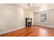 Bright living room with hardwood floors and decorative fireplace creating a cozy ambiance at 723 31St St, Denver, CO 80205