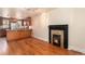 Inviting living room with adjacent kitchen, hardwood floors, and decorative fireplace at 723 31St St, Denver, CO 80205