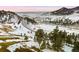 Rolling landscape with mountains and a road at 53 Canyon Pines Dr, Golden, CO 80403