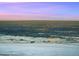 Stunning city view from a snowy landscape during a vibrant sunset at 53 Canyon Pines Dr, Golden, CO 80403