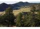 Scenic vista showcasing lush landscape, mountains, trees and open spaces, suggesting a tranquil and picturesque location at 53 Canyon Pines Dr, Golden, CO 80403