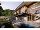 Modern home featuring a refreshing pool, sleek lines, and expansive windows that blend indoor and outdoor living at 53 Canyon Pines Dr, Golden, CO 80403