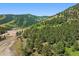 Scenic landscape view of rolling hills covered in lush greenery with a clear blue sky above at 53 Canyon Pines Dr, Golden, CO 80403