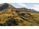 Scenic mountain landscape featuring lush green hills and valleys under a blue sky at 53 Canyon Pines Dr, Golden, CO 80403