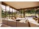Bright, modern living room featuring floor-to-ceiling windows, stylish furnishings, and a unique fireplace at 53 Canyon Pines Dr, Golden, CO 80403