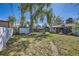 Backyard featuring a shed, lawn, and mature trees, offering both storage and outdoor recreational space at 5424 Saulsbury Ct, Arvada, CO 80002
