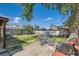 Backyard featuring patio furniture, a well-maintained lawn, and mature trees, ideal for outdoor gatherings at 5424 Saulsbury Ct, Arvada, CO 80002