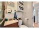 Bathroom showcasing a vanity, toilet, and modern fixtures at 5424 Saulsbury Ct, Arvada, CO 80002