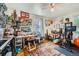 Bedroom featuring a ceiling fan, hardwood floors, a rug, and ample space for various activities at 5424 Saulsbury Ct, Arvada, CO 80002
