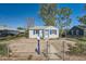 Home exterior showcasing the fenced front yard, adding security and curb appeal to the property at 5424 Saulsbury Ct, Arvada, CO 80002