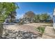 View of a property's front yard, showcasing a small yard with landscaping and neighborhood view at 5424 Saulsbury Ct, Arvada, CO 80002
