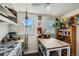 Bright kitchen featuring an island and ample storage, perfect for culinary creations and casual dining at 5424 Saulsbury Ct, Arvada, CO 80002