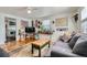 Inviting living room features hardwood floors, a stylish sofa, and eclectic decor for a personalized touch at 5424 Saulsbury Ct, Arvada, CO 80002