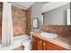 Cozy bathroom with tiled shower and classic vanity at 425 S Reed St, Lakewood, CO 80226
