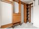 A spacious walk-in closet featuring custom wooden shelving, drawers, and ample storage space at 425 S Reed St, Lakewood, CO 80226