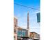 Bellmar, Downtown Lakewood street with tall signage and several shops and residential buildings in background at 425 S Reed St, Lakewood, CO 80226
