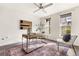 Sun-drenched home office featuring hardwood floors, modern decor, and bright natural light at 425 S Reed St, Lakewood, CO 80226