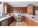 Well-equipped kitchen with stainless steel appliances and beautiful wood cabinets at 425 S Reed St, Lakewood, CO 80226