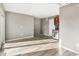 Spacious living room with hardwood floors, neutral paint, and beverage refrigerator and wine rack at 425 S Reed St, Lakewood, CO 80226