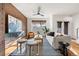 Bright living room with brick accent wall, stylish furnishings, and hardwood floors at 425 S Reed St, Lakewood, CO 80226