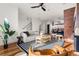 Open-concept living space featuring a modern staircase and stylish dining area at 425 S Reed St, Lakewood, CO 80226