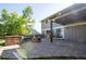 Backyard patio with a built-in grill, fire pit, and covered area, great for outdoor enjoyment at 7600 S Ulster Ct, Centennial, CO 80112