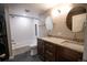Modern bathroom with dual sinks, granite countertops, and a subway-tiled shower/tub combo at 7600 S Ulster Ct, Centennial, CO 80112