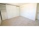 A bright bedroom offers ample storage space with built-in shelving and white walls to create a cozy atmosphere at 7600 S Ulster Ct, Centennial, CO 80112