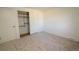 Spacious bedroom featuring a closet with ample storage and neutral carpet at 7600 S Ulster Ct, Centennial, CO 80112