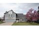 Charming home with well-maintained landscaping, a two-car garage, and inviting curb appeal at 7600 S Ulster Ct, Centennial, CO 80112