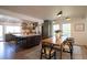 Spacious kitchen featuring an island with seating, stainless steel appliances, and a breakfast nook at 7600 S Ulster Ct, Centennial, CO 80112