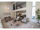 Bright living room with views to the dining room, kitchen and upper level at 7600 S Ulster Ct, Centennial, CO 80112