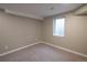 Neutral carpeted room with a window and an electrical outlet at 7600 S Ulster Ct, Centennial, CO 80112